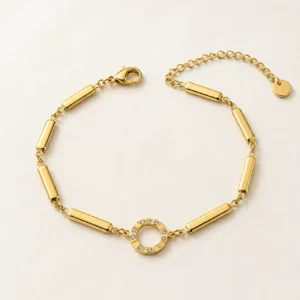 Aurelia anti-tarnish gold-plated bracelet with polished cylindrical links and crystal halo centre