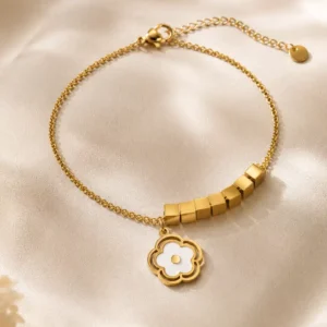 Anti-tarnish gold bracelet with white floral charm and geometric cube accents for women