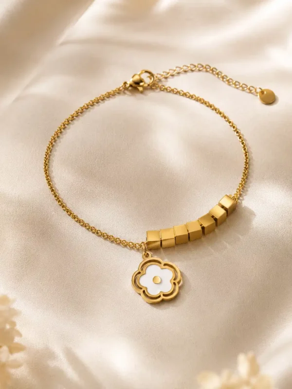 Anti-tarnish gold bracelet with white floral charm and geometric cube accents for women
