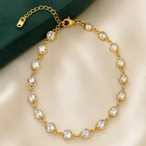 Elara gold plated bezel tennis bracelet with round cubic zirconia stones and adjustable chain