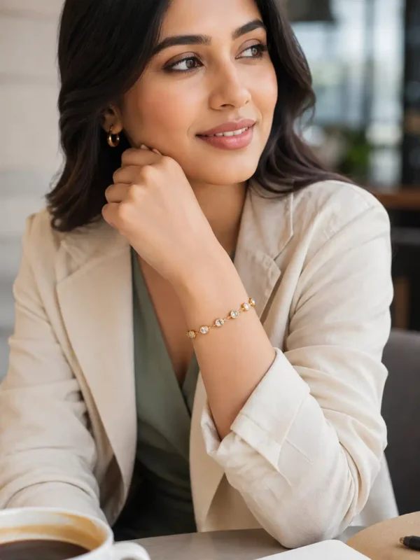 Woman wearing Elara gold plated tennis bracelet with bezel-set CZ stones for office wear
