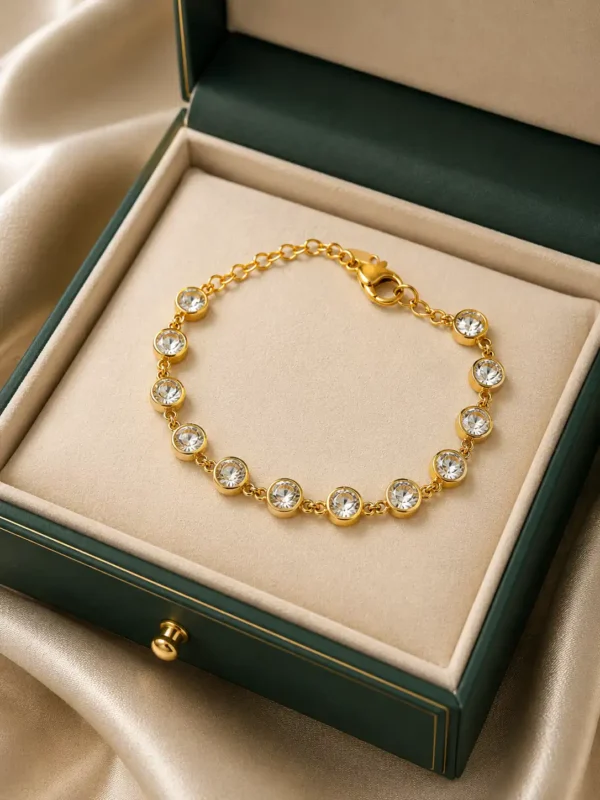 Elara gold plated CZ tennis bracelet displayed in a premium green jewellery box