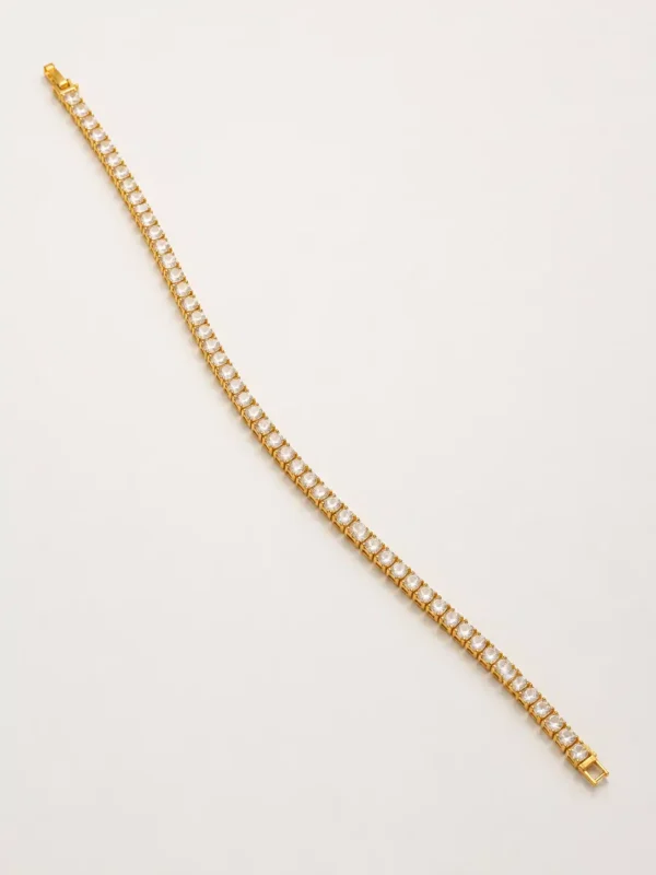 Full length 19 cm gold plated CZ tennis bracelet with clasp on white background