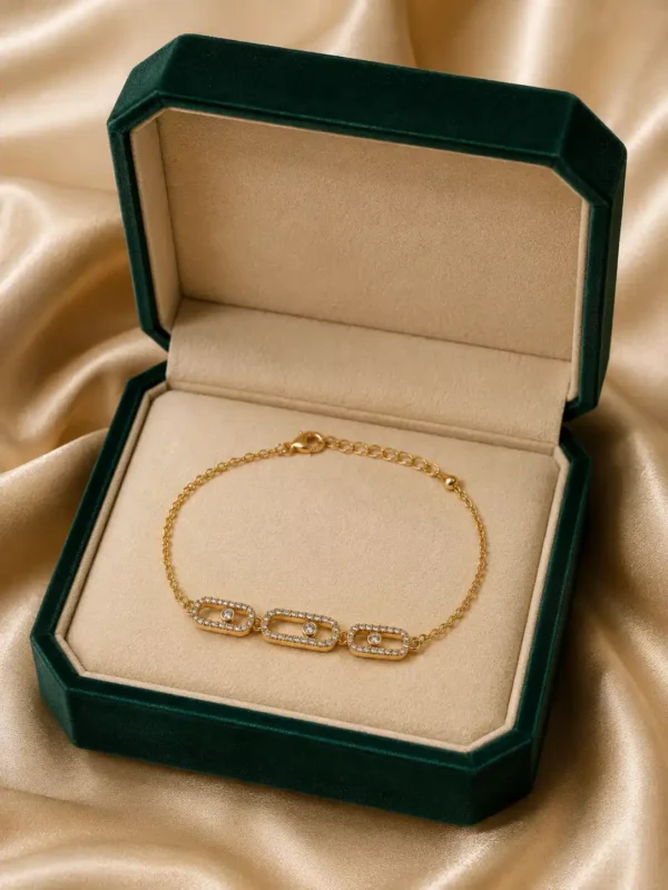 Aurelia triple crystal link bracelet displayed in green jewellery box