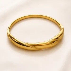 Anti-tarnish gold hinged bangle for women with a polished overlapping twist design
