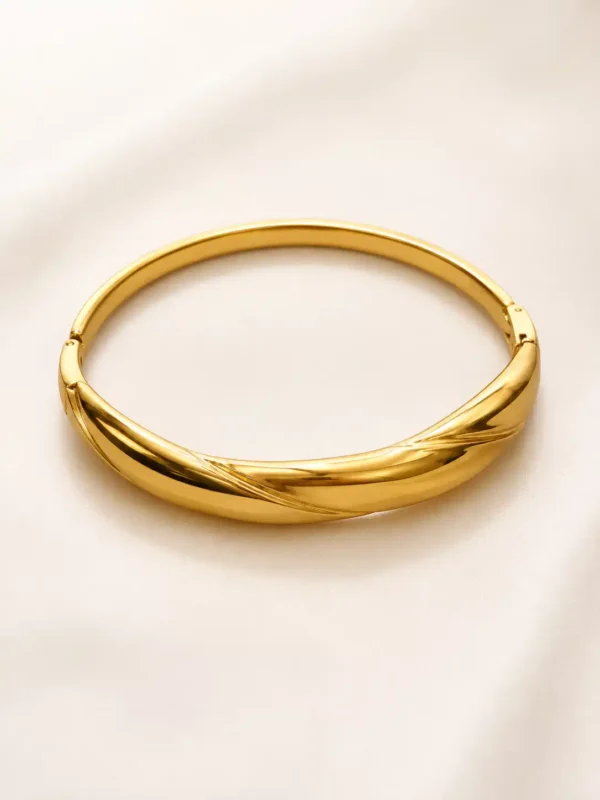 Anti-tarnish gold hinged bangle for women with a polished overlapping twist design