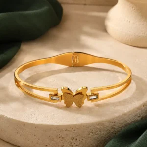 Anti-tarnish gold butterfly bangle for women with textured butterfly centrepiece and crystal accents