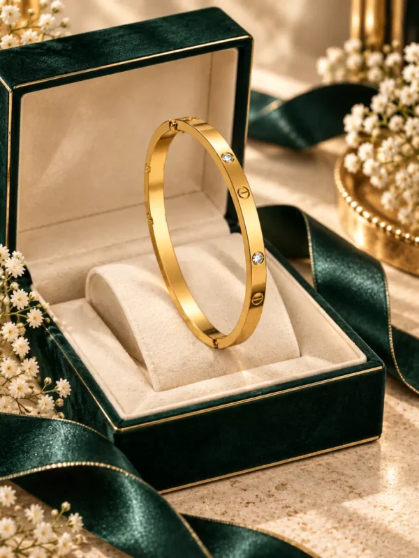 Gold crystal screw bangle for women displayed in luxury jewellery box