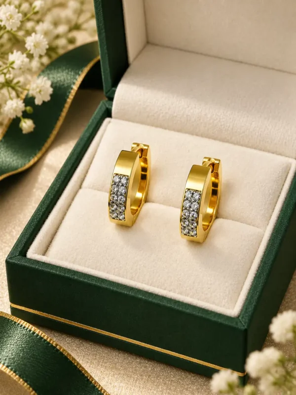 Pair of anti-tarnish gold crystal huggie earrings in premium jewellery box