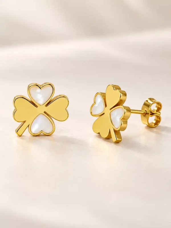 Front and side view of gold clover stud earrings with mother-of-pearl heart inlays and push-back closure
