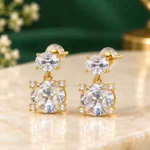 Gold-plated double crystal drop earrings with oval top stones and larger clear round crystals