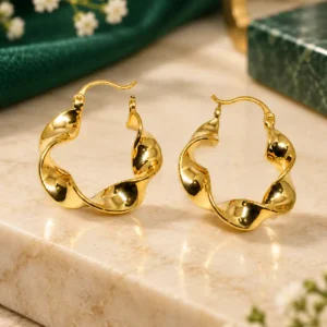 Elara anti-tarnish gold twist hoop earrings with sculpted wavy design