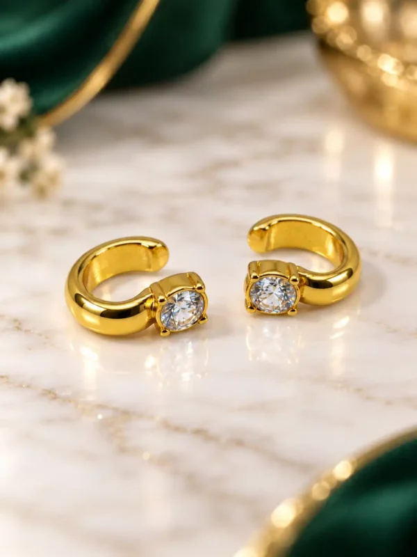 Minimal gold CZ ear cuff pair with open curved shape and round clear stones