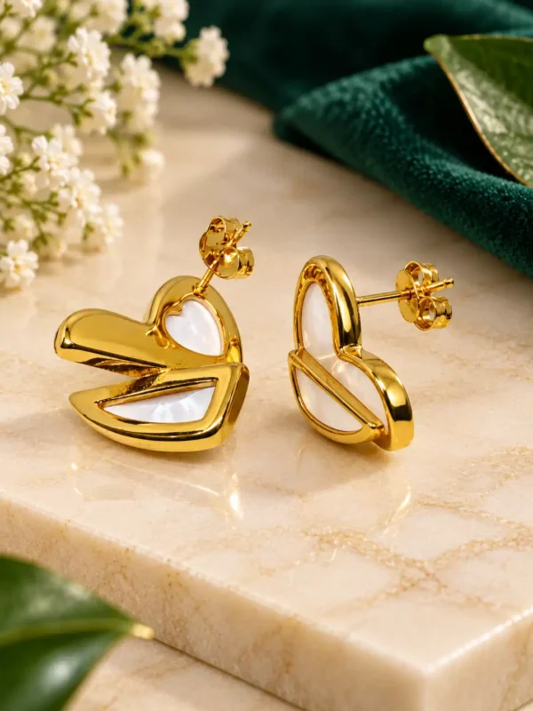 Side and back view of Ivory Sculpt gold heart stud earrings showing post and push-back closure