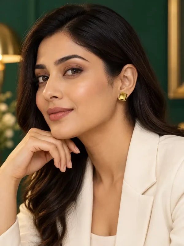 Woman wearing 1 cm anti-tarnish gold-tone layered square stud earrings with white blazer
