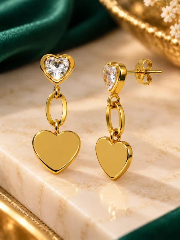 Front and side view of anti-tarnish heart drop earrings showing gold post back, CZ stud and heart charm