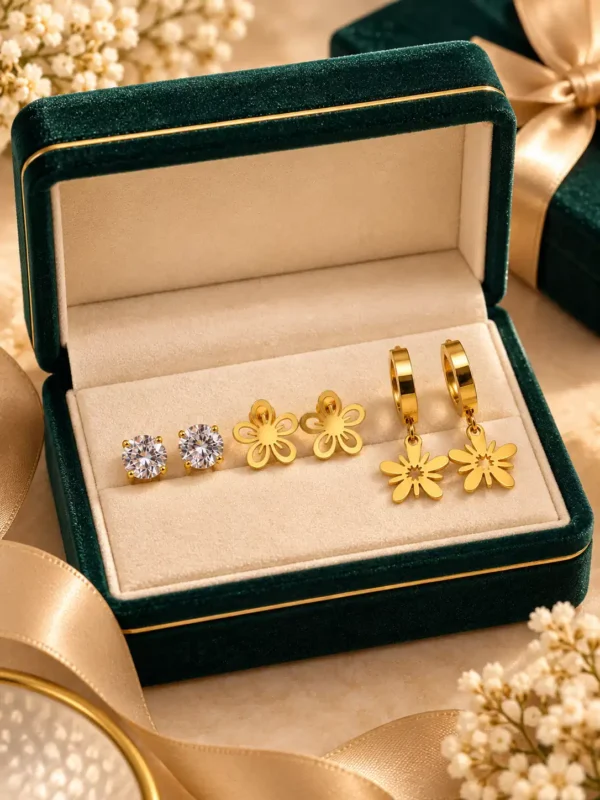 Anti-tarnish three-pair gold earring set displayed in green jewellery box with crystal and floral designs