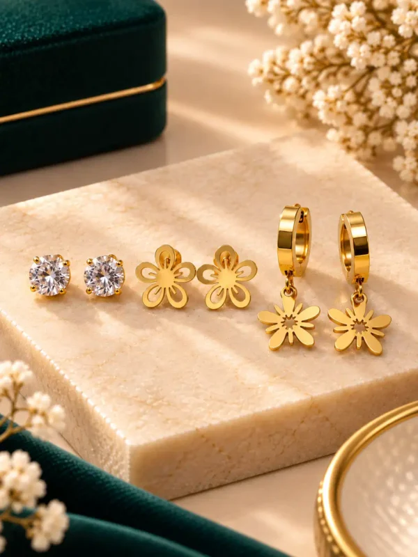 Gold-plated earring set with round crystal studs, open flower studs and hanging flower hoop earrings