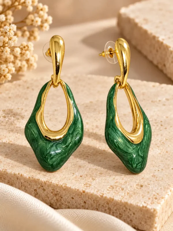 Green enamel drop earrings showing gold-tone posts and open geometric construction