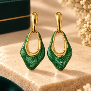 Anti-tarnish green enamel drop earrings with gold-tone open geometric design, front view