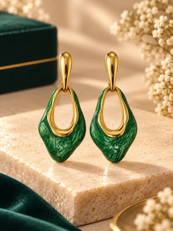 Anti-tarnish green enamel drop earrings with gold-tone open geometric design, front view