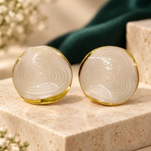 Ivory Ripple anti-tarnish marble-look stud earrings with organic round shape and polished gold-tone edging