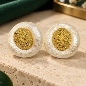 Ivory Halo anti-tarnish gold stud earrings with textured ivory pearl-effect surround