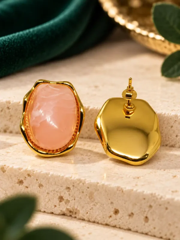 Front and back view of pink gold stud earrings showing post and push-back closure