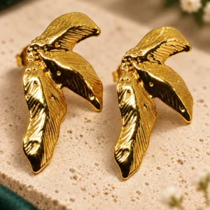 Aurelia anti-tarnish gold wing stud earrings with sculpted textured leaf design, front view