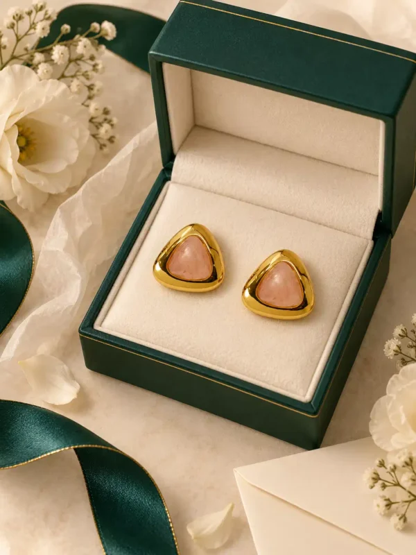 Blush pink gold stud earrings in elegant jewellery gift box with flowers