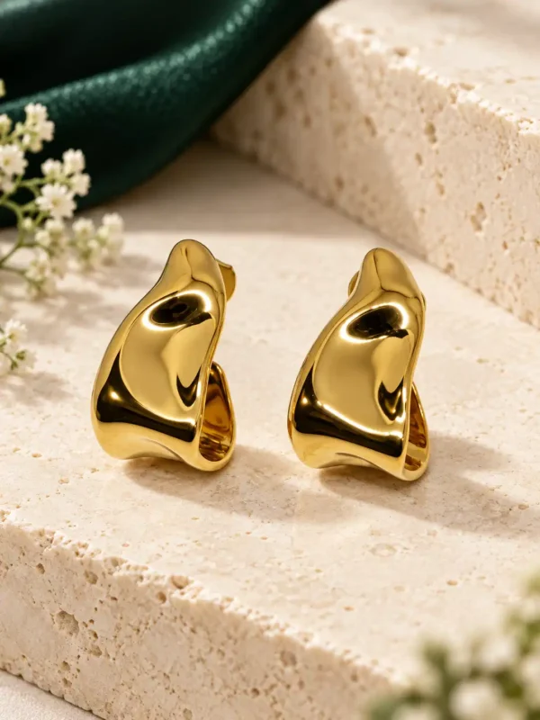 Amara anti-tarnish gold half hoop earrings with smooth molten sculptural design