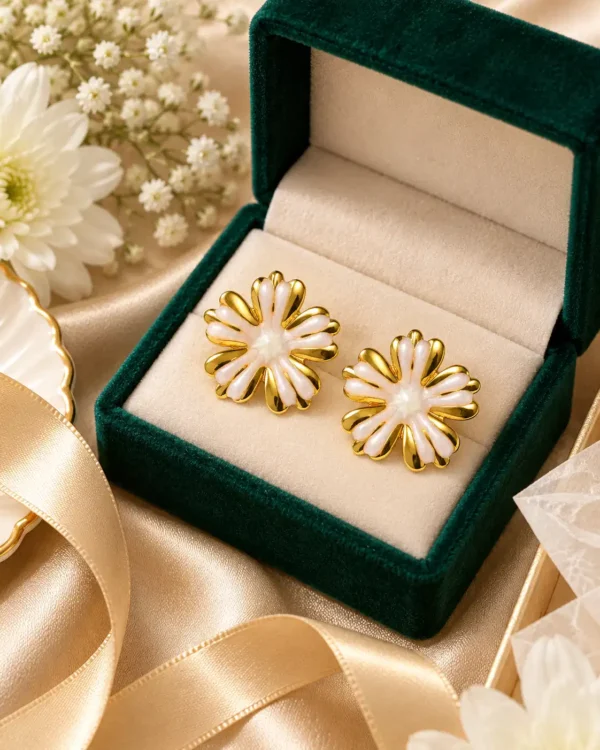 White and gold Aurelia floral stud earrings in green jewellery box with ivory ribbon and flowers
