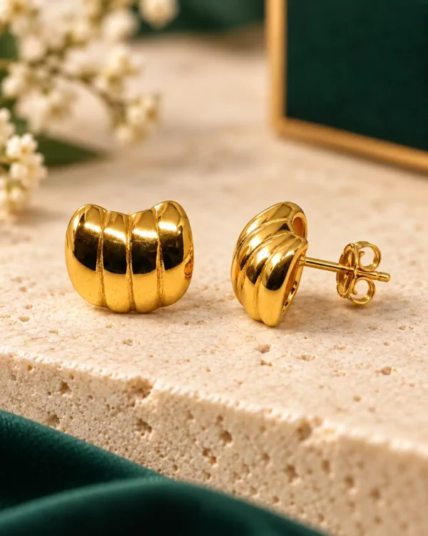 Gold ribbed dome stud earrings showing front design, post and push-back closure