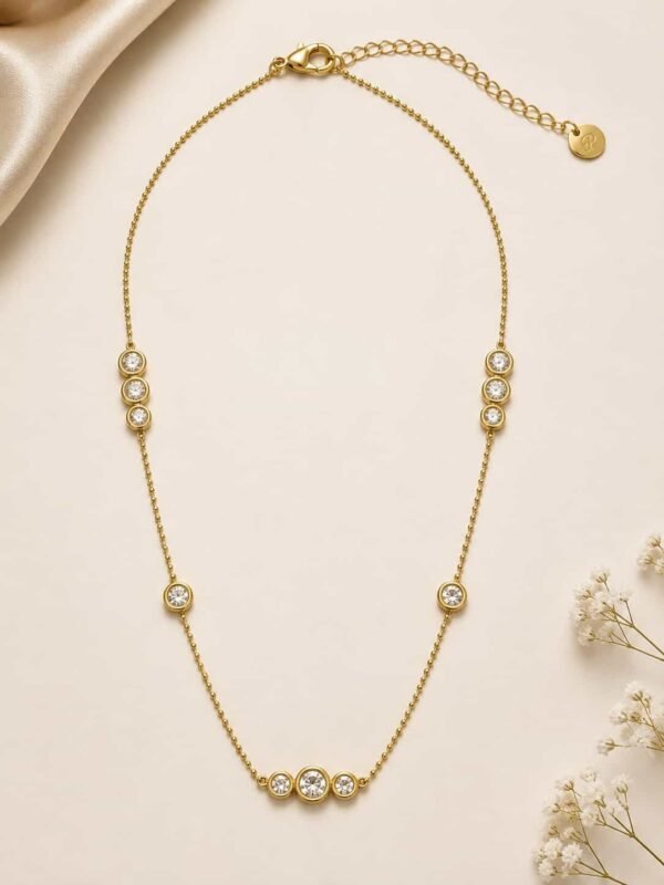 Aurelia gold-tone bezel station necklace with clear CZ stones, lobster clasp and adjustable extender chain