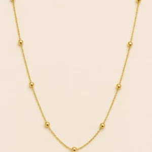 Solene gold bead station necklace with polished round beads on a delicate gold-tone chain