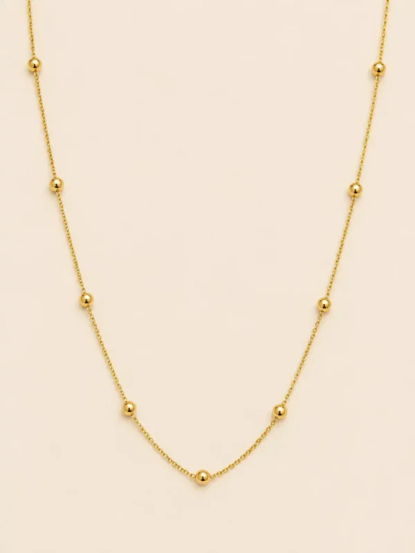 Solene gold bead station necklace with polished round beads on a delicate gold-tone chain