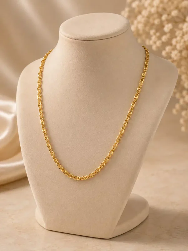 Mirelle gold twist-link chain necklace displayed on ivory jewellery bust showing everyday length and drape