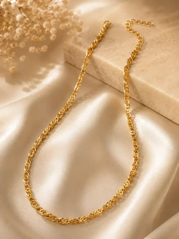 Mirelle textured gold chain necklace with lobster clasp and extension links styled on ivory satin