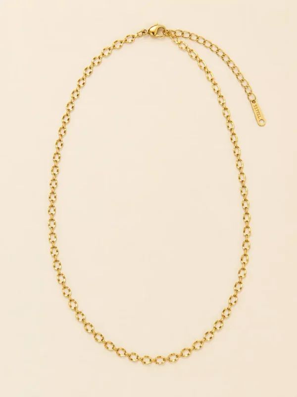 Full Aurelia gold loop chain necklace with lobster clasp, extension chain and textured oval links on cream background