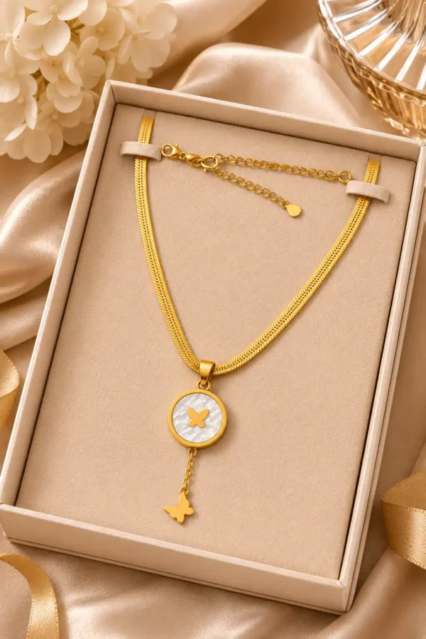 Liora Flutter gold butterfly pendant necklace displayed in jewellery presentation box