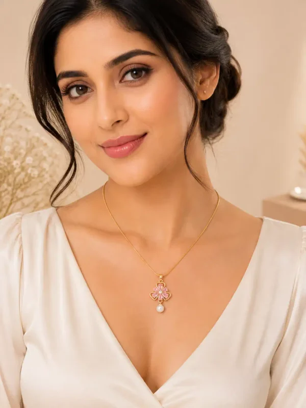 Woman wearing Rosé Bloom anti-tarnish pink crystal flower pendant necklace with pearl drop