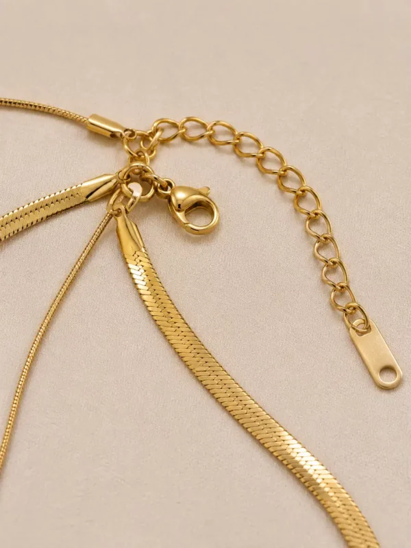 Elara layered necklace lobster clasp and gold-tone extender chain close-up