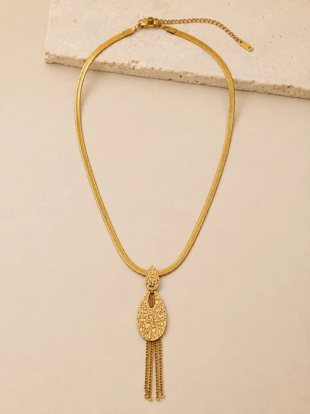 Full Aurelia anti-tarnish gold tassel necklace with flat snake chain, textured teardrop pendant, lobster clasp and extender
