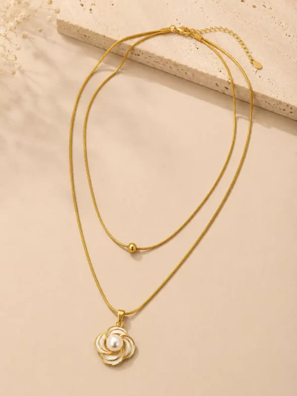 Full Elara double-layer gold necklace with centre bead, white floral pearl pendant, clasp and extender chain