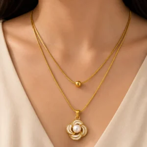 Elara Pearl Bloom anti-tarnish layered gold necklace with white floral pearl pendant worn on neckline