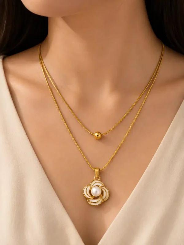 Elara Pearl Bloom anti-tarnish layered gold necklace with white floral pearl pendant worn on neckline