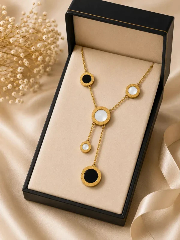 Vera black and white gold lariat necklace presented in jewellery gift box