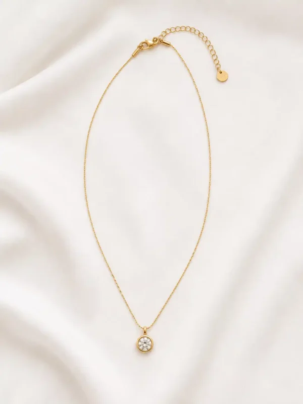 Full Elara solitaire pendant necklace with fine gold-tone chain, lobster clasp, extender chain and round crystal pendant