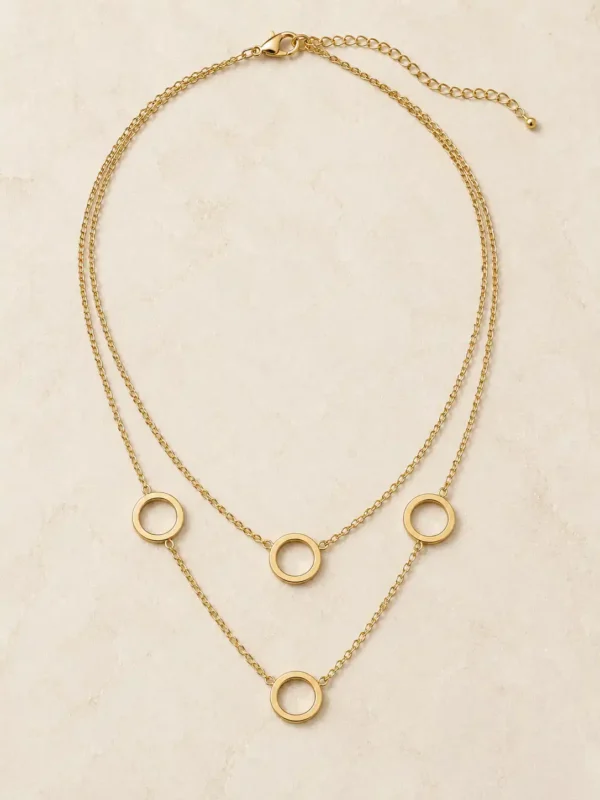 Full dual-layer gold-plated open circle necklace laid flat with lobster clasp and extension chain visible