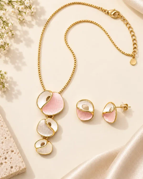 Full Blush Orbit anti-tarnish pendant and stud earring set showing gold-tone chain, clasp, extension chain and pink-white design